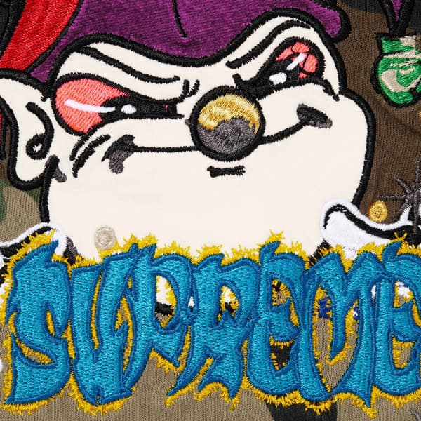 Supreme AOI Jester S/S Top - Woodland Camo (front)