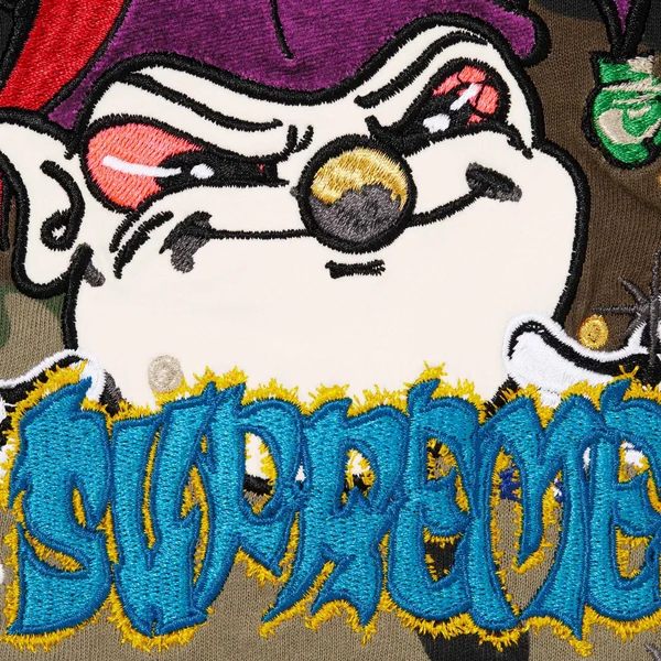 Supreme AOI Jester S/S Top - Woodland Camo (front)