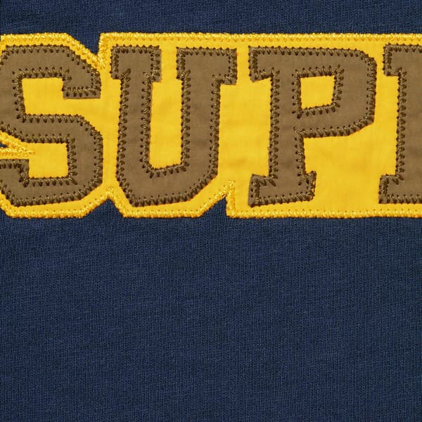 Supreme Satin Appliqué S/S Top - Navy (front)